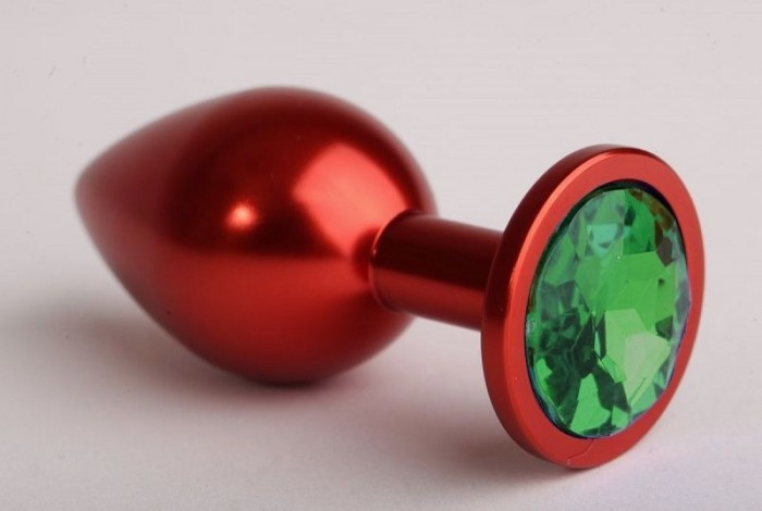 Красная анальная пробка с зелёным стразом - 7,6 см.
