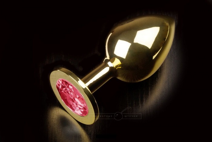 Большая золотая анальная пробка с закругленным кончиком и рубиновым кристаллом - 9 см.